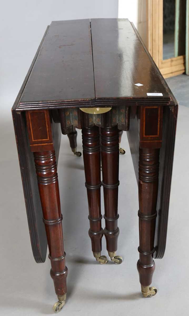 A Regency mahogany concertina-action extending dining table, in the manner of Wilkinson of - Image 16 of 16