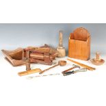 A mixed group of treen, including a cutlery tray, a clapper and a softwood ladle.