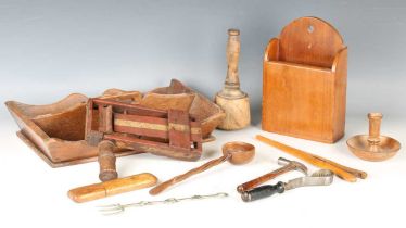 A mixed group of treen, including a cutlery tray, a clapper and a softwood ladle.