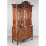 A 19th century French oak side cabinet with an arched pediment and four carved panel doors, height