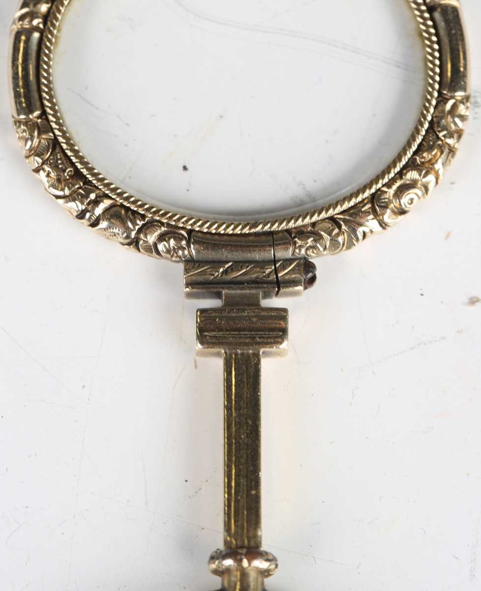 A mid-19th century gold framed magnifying lens, finely chased with foliage, length 8cm. - Image 8 of 12