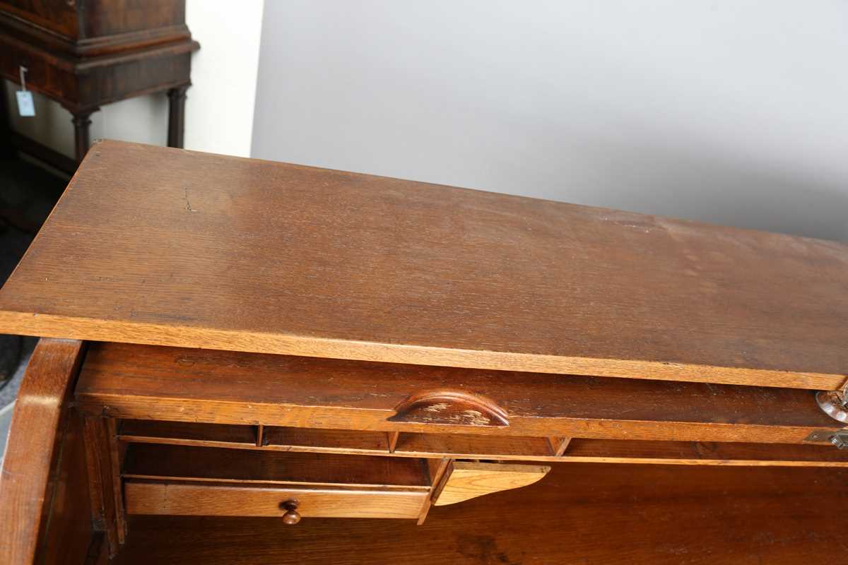 An Art Deco oak roll-top desk, fitted with an arrangement of drawers, height 114cm, width 150cm, - Image 6 of 12