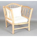 A large naturalistic wooden 'statement' armchair, height 96cm, width 90cm, depth 75cm. Provenance: