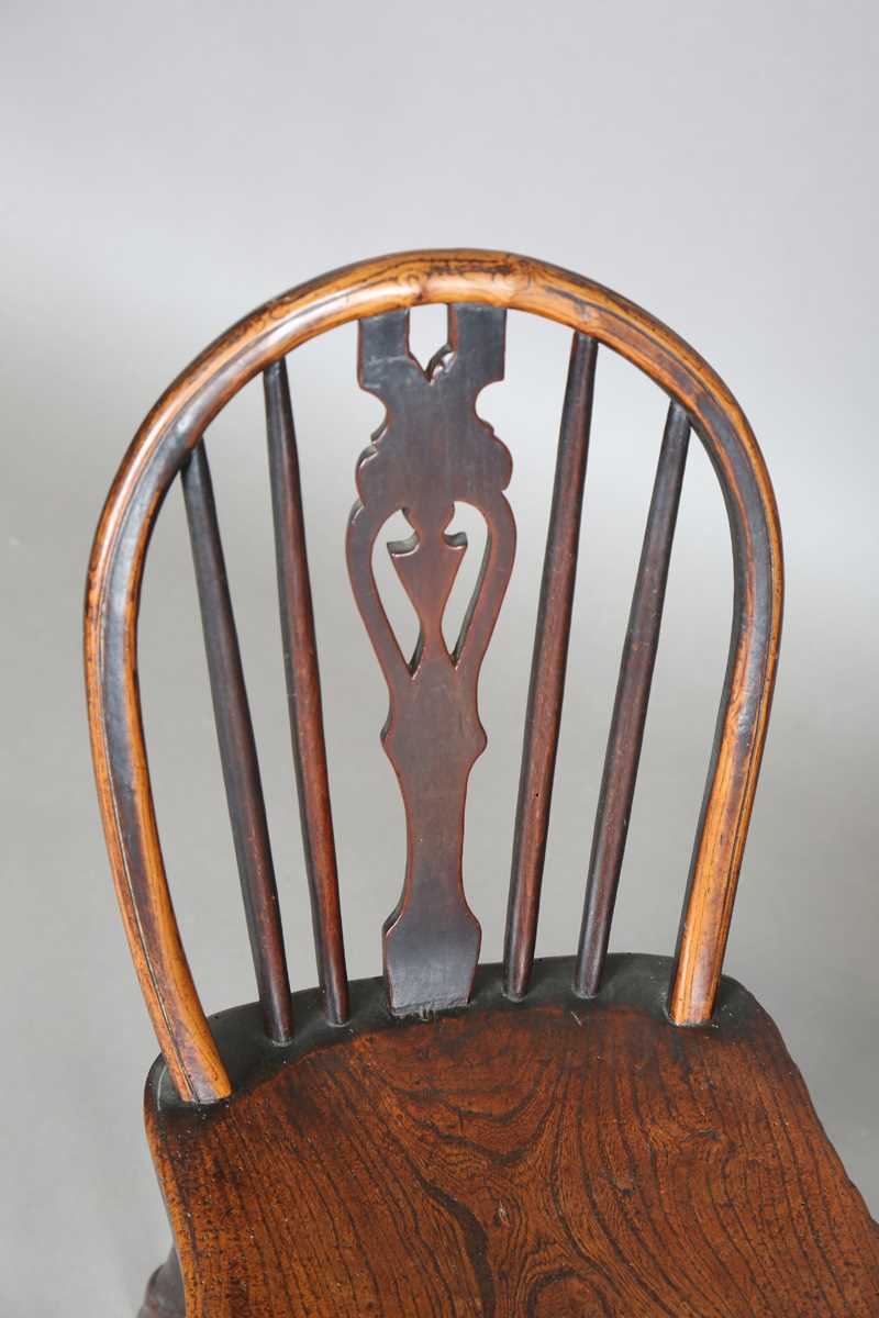 A 19th century child’s beech and elm Windsor chair, on turned legs united by stretchers, height - Image 2 of 17