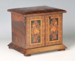 A late Victorian Tunbridge ware table-top cabinet with a geometric cuboid panel above two doors