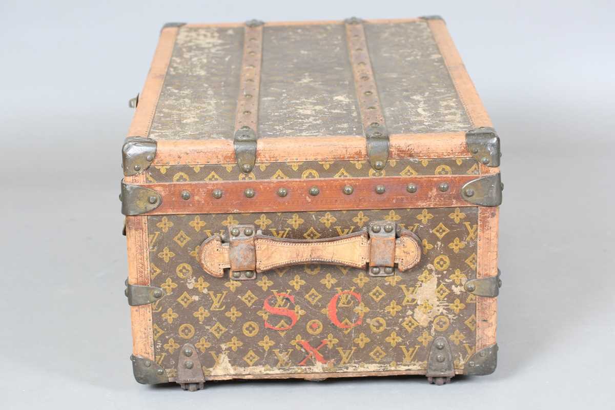An early 20th century Louis Vuitton travelling trunk with overall monogram canvas covering and tan - Image 35 of 42
