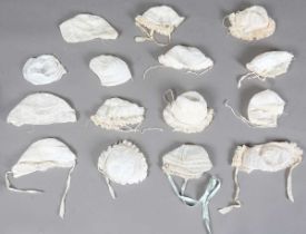 A group of fifteen 19th century linen babies' bonnets, the majority with fine inset lacework