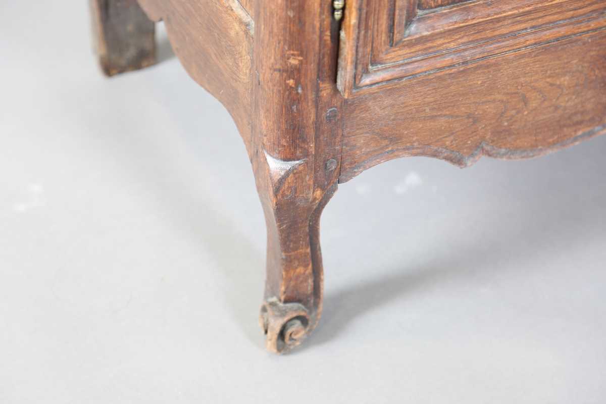 A 19th century French oak side cabinet with an arched pediment and four carved panel doors, height - Image 8 of 14