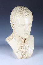 An early 20th century cream glazed porcelain head and shoulders portrait bust of the Duke of