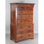 A George III mahogany chest-on-chest with inlaid foliate panels and oak-lined drawers, height 185cm,