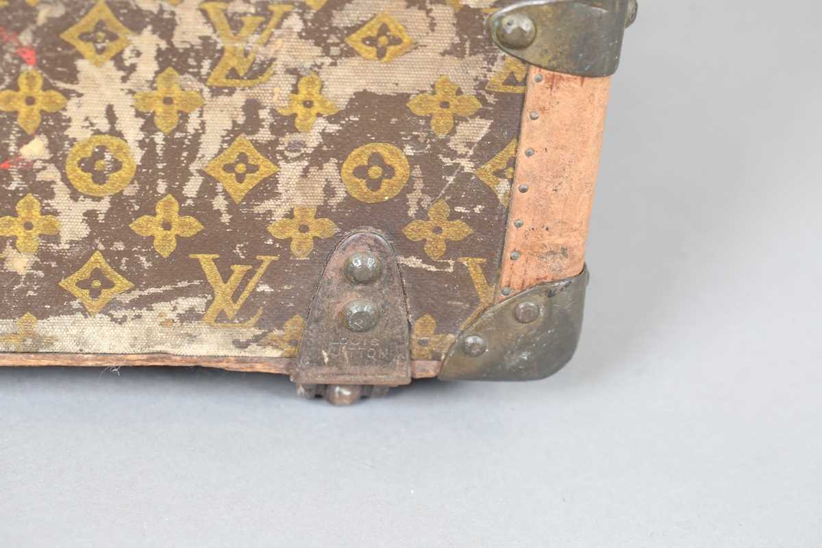 An early 20th century Louis Vuitton travelling trunk with overall monogram canvas covering and tan - Image 22 of 42