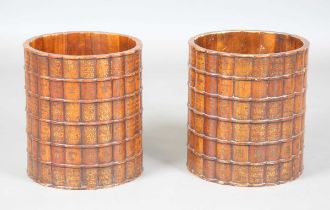 A pair of 20th century hardwood waste paper baskets, the sides carved and detailed in gilt to