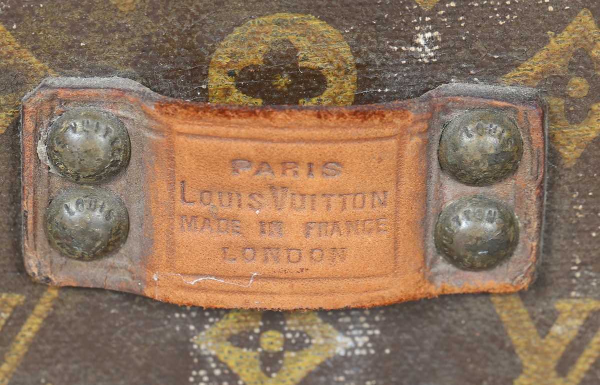 An early 20th century Louis Vuitton travelling trunk with overall monogram canvas covering and tan - Image 4 of 42
