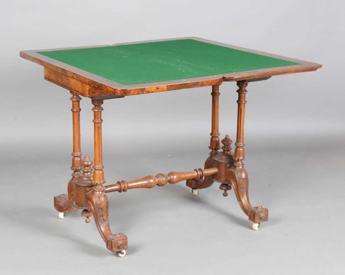 A mid-Victorian burr walnut rectangular fold-over card table, raised on fluted legs and carved feet, - Image 3 of 14