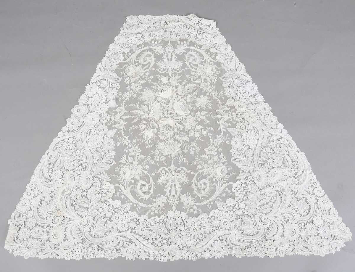 A 19th century Brussels Point de Gaze lace triangular panel, probably from the train of a dress,