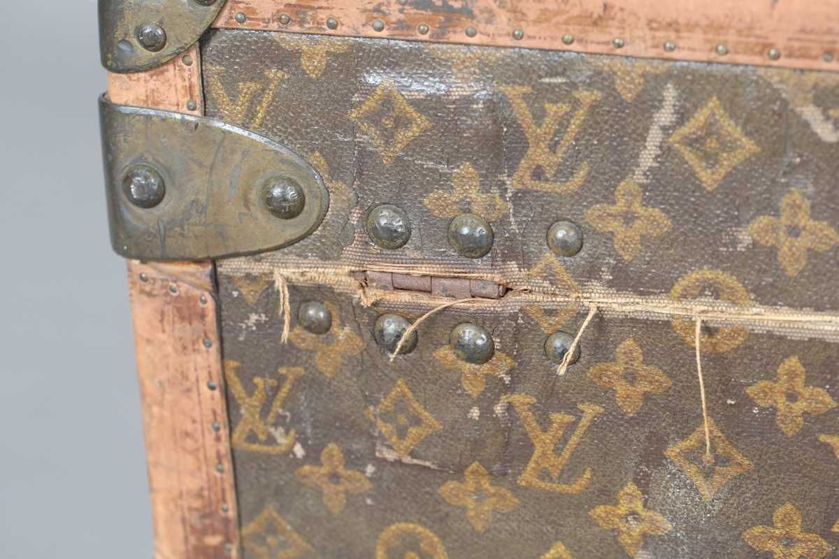 An early 20th century Louis Vuitton travelling trunk with overall monogram canvas covering and tan - Image 29 of 42