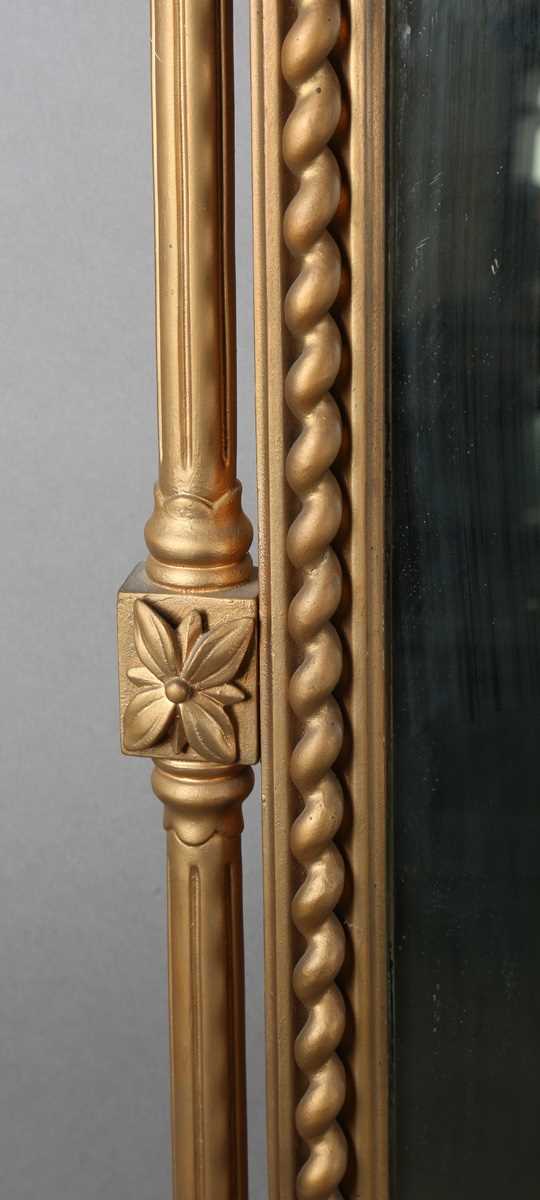 A late Victorian gilt painted overmantel mirror with pierced foliate corner panels and spiral turned - Image 5 of 9