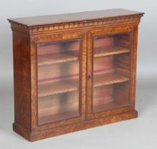 A fine early Victorian flame mahogany table-top or wall-hanging cabinet, in the manner of Gillows of