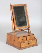 An 18th century walnut swing frame dressing table mirror, fitted with three drawers, height 51cm,