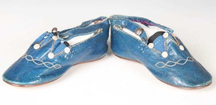 A pair of 19th century blue leather infant's shoes with applied mother-of-pearl buttons and polished