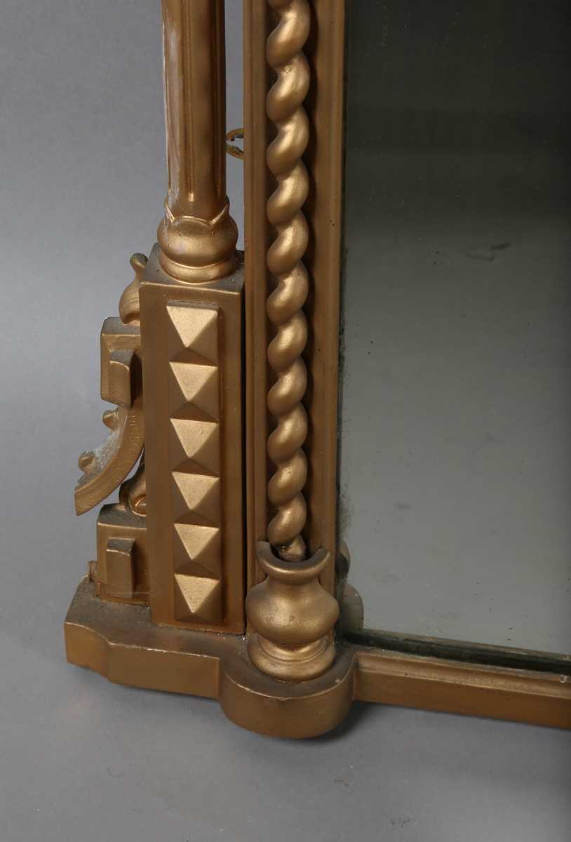 A late Victorian gilt painted overmantel mirror with pierced foliate corner panels and spiral turned - Image 7 of 9