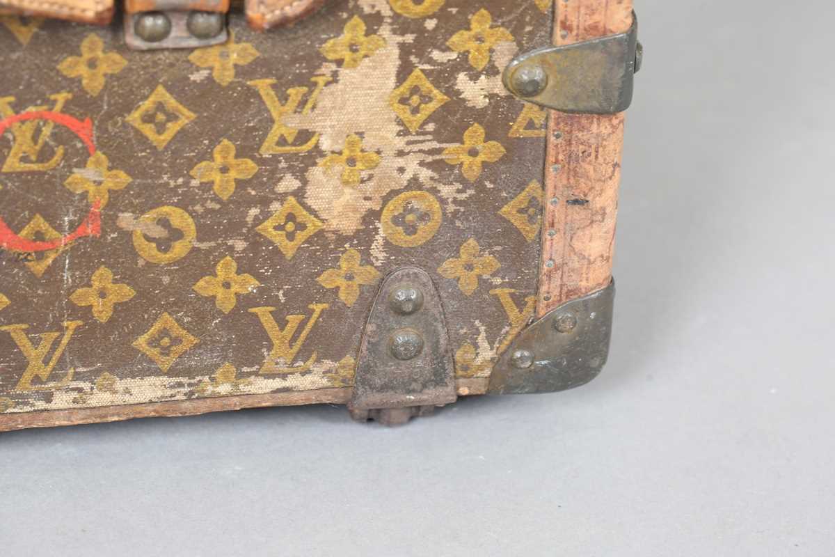 An early 20th century Louis Vuitton travelling trunk with overall monogram canvas covering and tan - Image 40 of 42