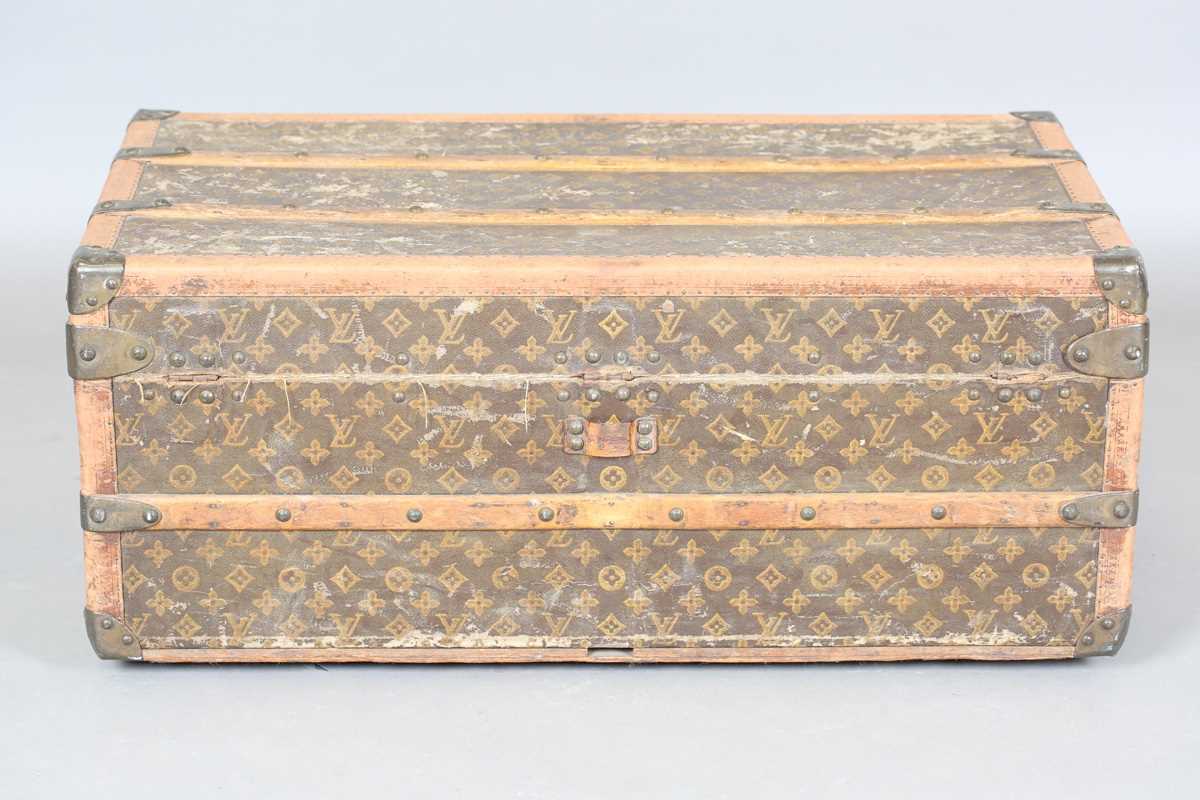 An early 20th century Louis Vuitton travelling trunk with overall monogram canvas covering and tan - Image 26 of 42
