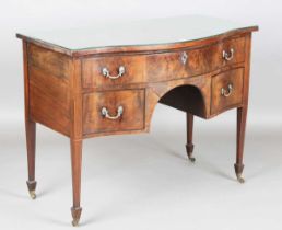 A 19th century George III style mahogany serpentine fronted sideboard with crossbanded borders and