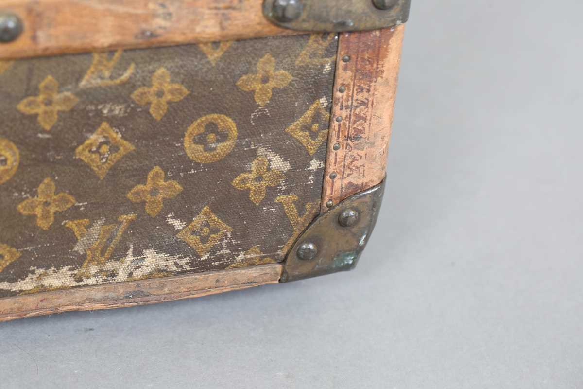 An early 20th century Louis Vuitton travelling trunk with overall monogram canvas covering and tan - Image 33 of 42
