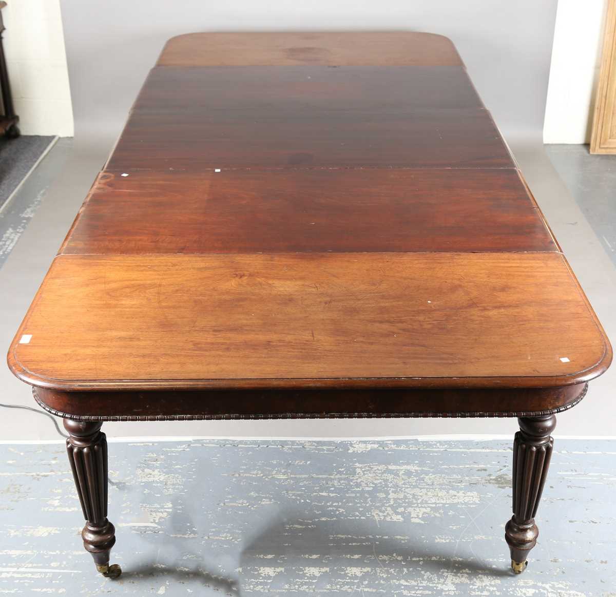 A William IV mahogany pull-out extending dining table, in the manner of Gillows of Lancaster, the - Image 2 of 13