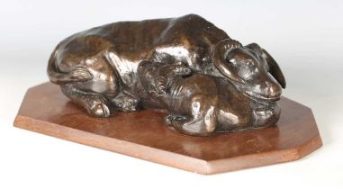 D. Foster - a late 20th century patinated cold cast bronze model of a buffalo and calf, mounted on a