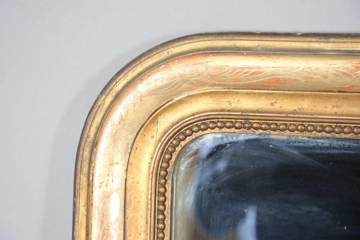 A 19th century French gilt gesso pier mirror with an arched foliate decorated frame, 138cm x 85cm. - Image 2 of 10