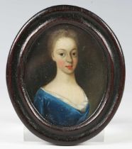 British School - an 18th century watercolour portrait miniature on ivory depicting a lady wearing