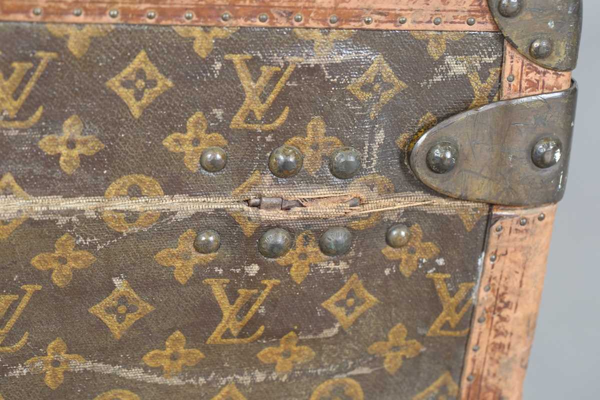 An early 20th century Louis Vuitton travelling trunk with overall monogram canvas covering and tan - Image 28 of 42