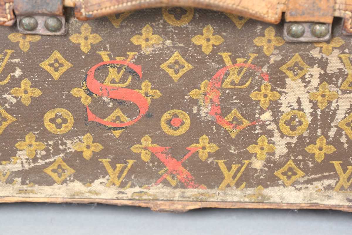 An early 20th century Louis Vuitton travelling trunk with overall monogram canvas covering and tan - Image 21 of 42