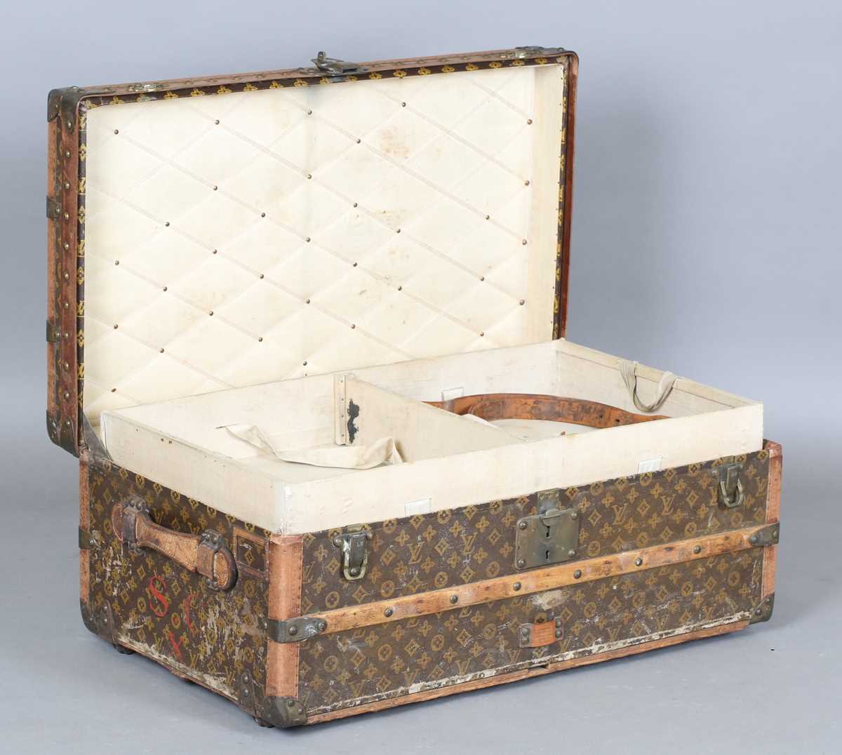 An early 20th century Louis Vuitton travelling trunk with overall monogram canvas covering and tan - Image 13 of 42
