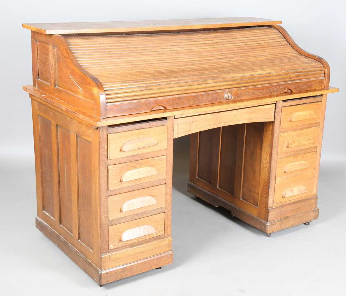 An Art Deco oak roll-top desk, fitted with an arrangement of drawers, height 114cm, width 150cm, - Image 11 of 12