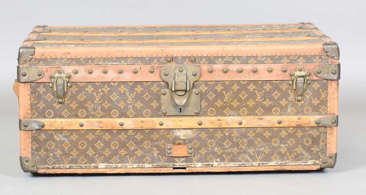 An early 20th century Louis Vuitton travelling trunk with overall monogram canvas covering and tan - Image 2 of 42