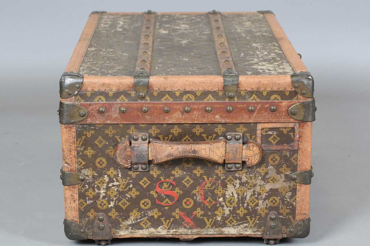 An early 20th century Louis Vuitton travelling trunk with overall monogram canvas covering and tan - Image 20 of 42