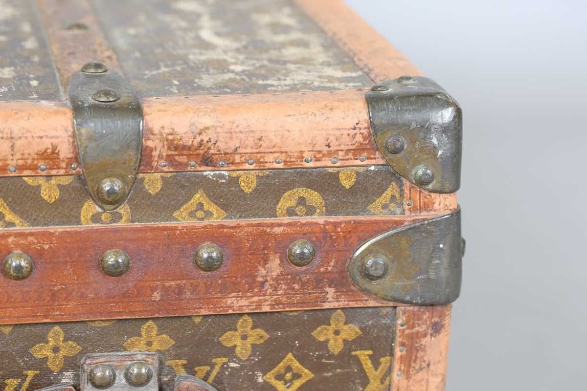 An early 20th century Louis Vuitton travelling trunk with overall monogram canvas covering and tan - Image 38 of 42