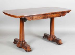 A Regency rosewood library table, the curve-ended top above two frieze drawers and turned