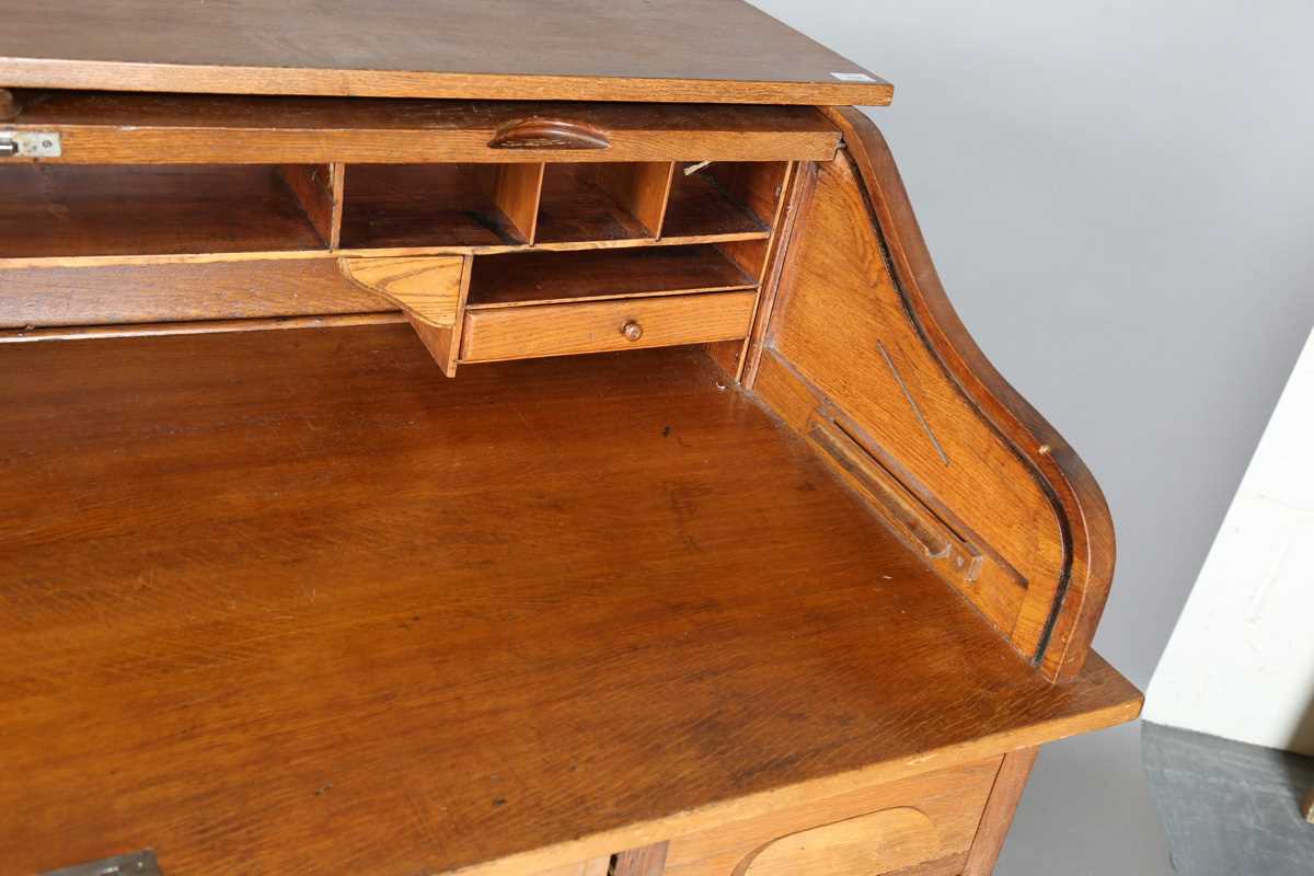 An Art Deco oak roll-top desk, fitted with an arrangement of drawers, height 114cm, width 150cm, - Image 3 of 12