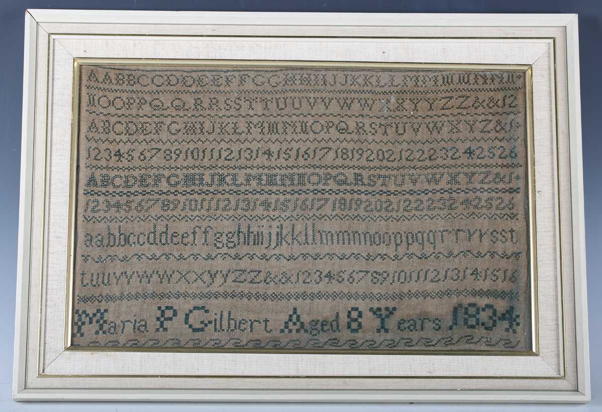 A William IV needlework sampler by Maria P Gilbert, aged 8 years, dated 1834, finely worked in green