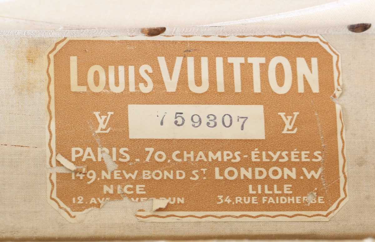 An early 20th century Louis Vuitton travelling trunk with overall monogram canvas covering and tan - Image 14 of 42