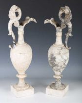 A pair of early 20th century Neoclassical Revival carved and turned alabaster ornamental urns,