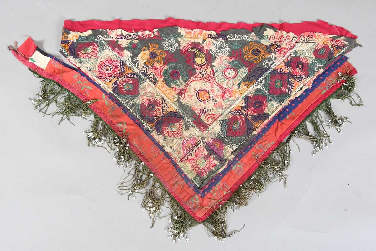 An Uzbekistan silk embroidered suzani, the triangular panel finely worked with scrolling - Image 10 of 12