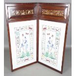 A late Victorian Aesthetic Movement mahogany framed two-fold draught screen, inset with silverwork