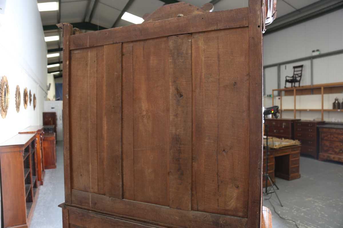A 19th century French oak side cabinet with an arched pediment and four carved panel doors, height - Image 11 of 14