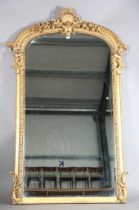 A mid-Victorian giltwood and gesso overmantel mirror with bevelled plate glass and a foliate scallop
