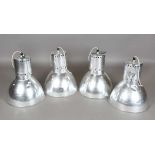 A set of four aluminium industrial ceiling lights of domed form, height 55cm, diameter 50cm.